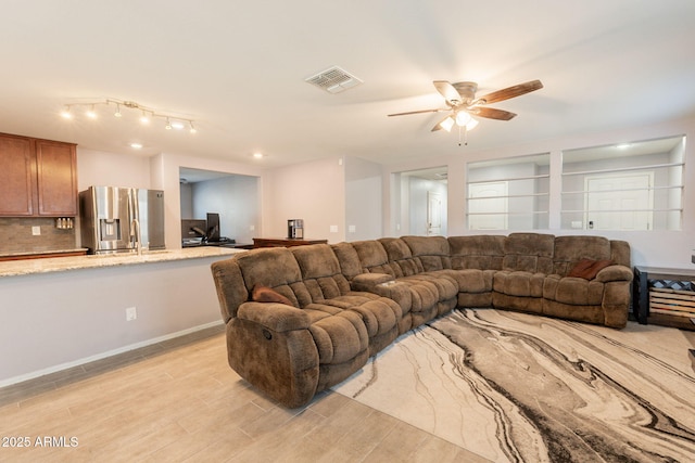7238 N 126th Ln, Glendale, AZ 85307 - living room with ceiling fan and light wood-style flooring