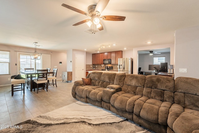 7238 N 126th Ln, Glendale, AZ 85307 - living room with ceiling fan, recessed lighting, plenty of natural light, and light wood-type flooring
