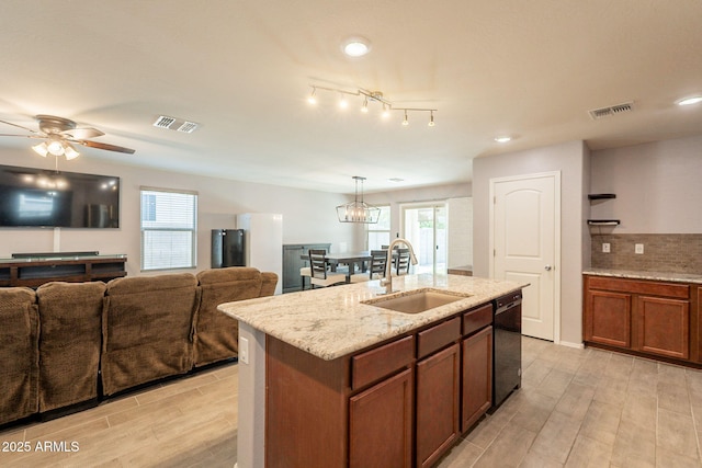 7238 N 126th Ln, Glendale, AZ 85307 - kitchen featuring black dishwasher, light wood finished floors, an island with sink, light stone counters, and recessed lighting