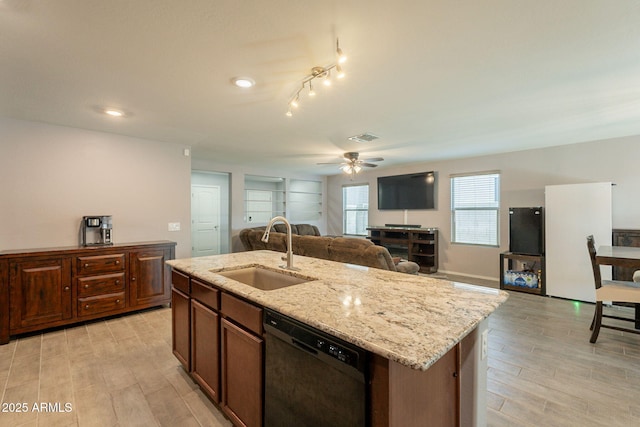 7238 N 126th Ln, Glendale, AZ 85307 - kitchen with dishwasher, ceiling fan, light wood-style floors, open floor plan, and a kitchen island with sink