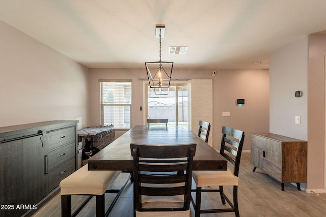 7238 N 126th Ln, Glendale, AZ 85307 - dining room featuring wood finished floors and baseboards