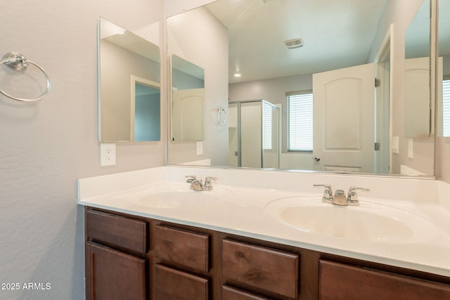 7238 N 126th Ln, Glendale, AZ 85307 - full bath with double vanity, a stall shower, and a textured wall