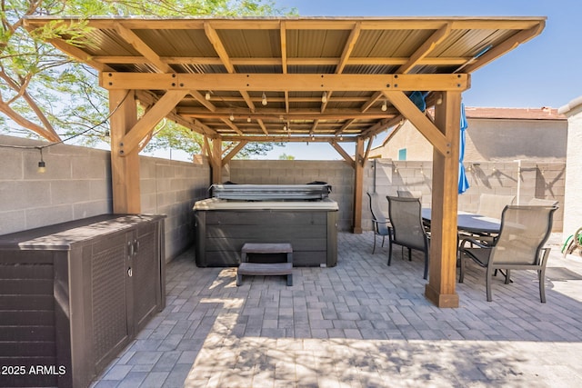 7238 N 126th Ln, Glendale, AZ 85307 - fenced backyard featuring a hot tub, a patio, and outdoor dining space