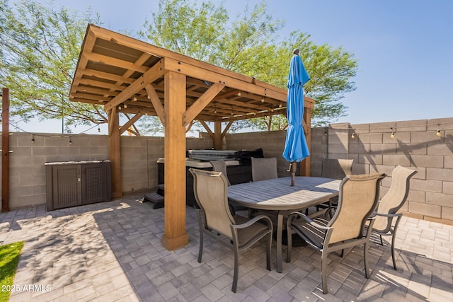7238 N 126th Ln, Glendale, AZ 85307 - fenced backyard featuring a hot tub, a patio area, and outdoor dining space