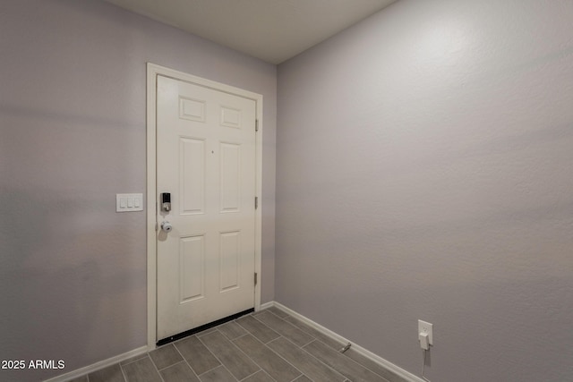 7238 N 126th Ln, Glendale, AZ 85307 - doorway to outside featuring baseboards and wood finish floors