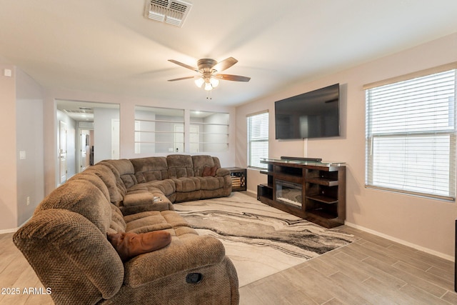 7238 N 126th Ln, Glendale, AZ 85307 - living room featuring ceiling fan and wood finished floors