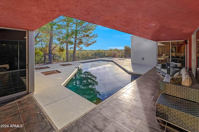 view of swimming pool featuring a patio area