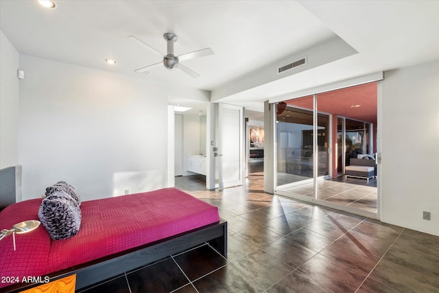 tiled bedroom featuring ceiling fan