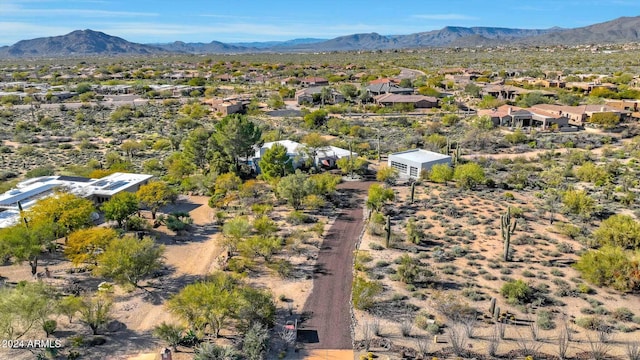 birds eye view of property featuring a mountain view