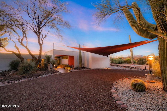 view of front of property featuring a carport