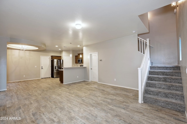 unfurnished living room featuring light hardwood / wood-style flooring