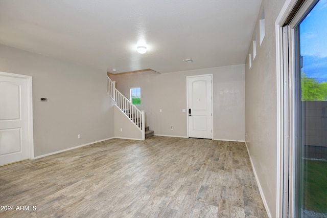 unfurnished room featuring light wood-type flooring