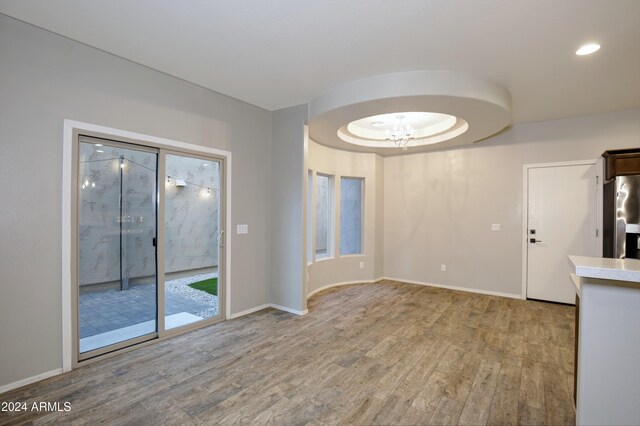 unfurnished living room with hardwood / wood-style flooring