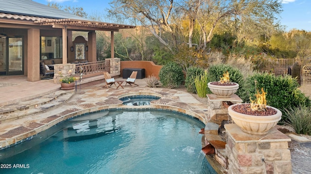 view of pool featuring a fenced in pool, a patio area, fence, and an in ground hot tub