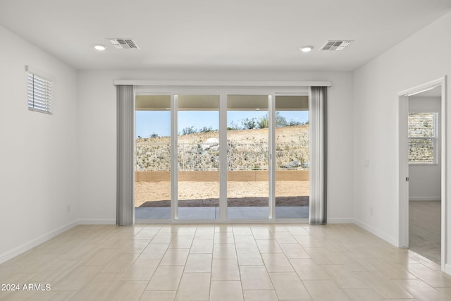 doorway to outside featuring light tile patterned floors