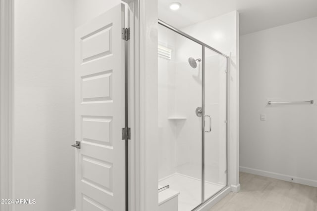 bathroom featuring an enclosed shower