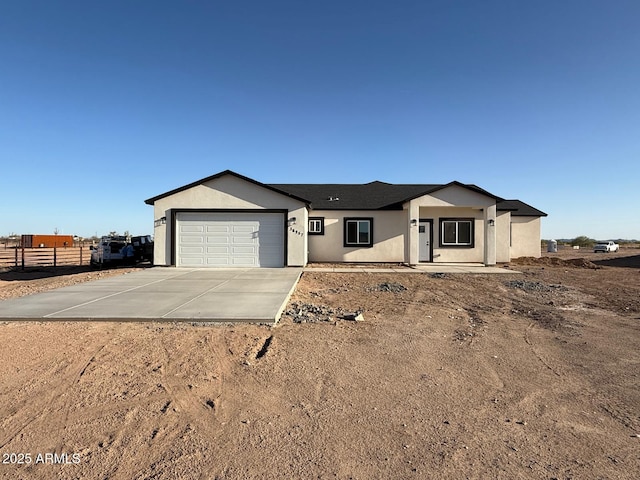 36257 W Highland Ave, Tonopah, AZ 85354 - ranch-style home featuring driveway, an attached garage, and stucco siding