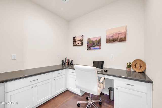 tiled office featuring built in desk