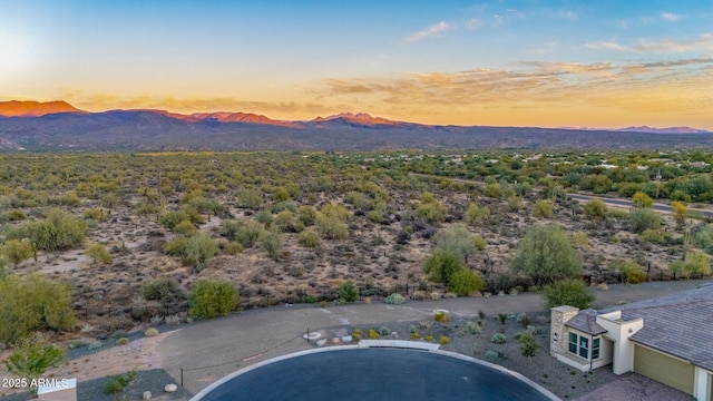 aerial view at dusk with a mountain view