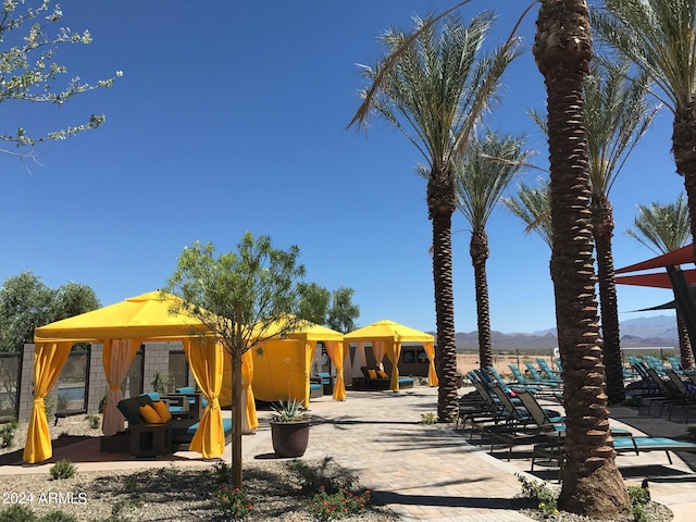 view of play area with a gazebo and a mountain view