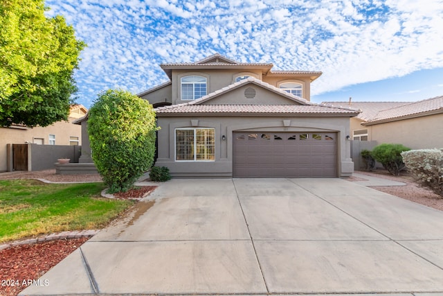 mediterranean / spanish-style house featuring a garage