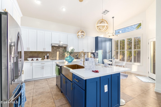 kitchen featuring sink, hanging light fixtures, blue cabinetry, high vaulted ceiling, and stainless steel refrigerator with ice dispenser