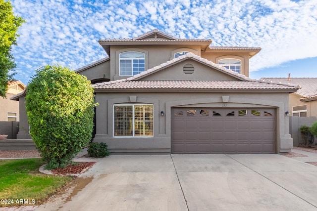 mediterranean / spanish-style home featuring a garage