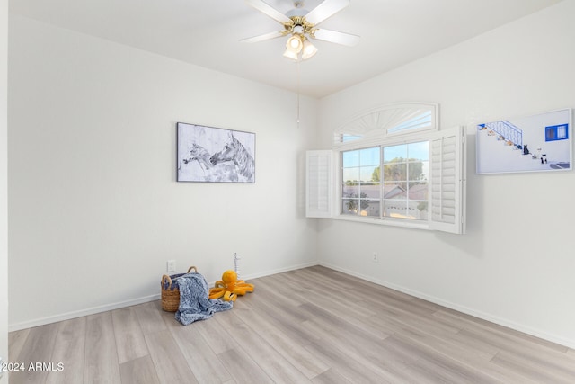 empty room featuring light wood-type flooring and ceiling fan