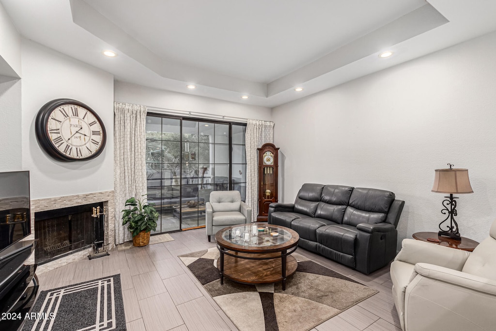 living room with a tray ceiling