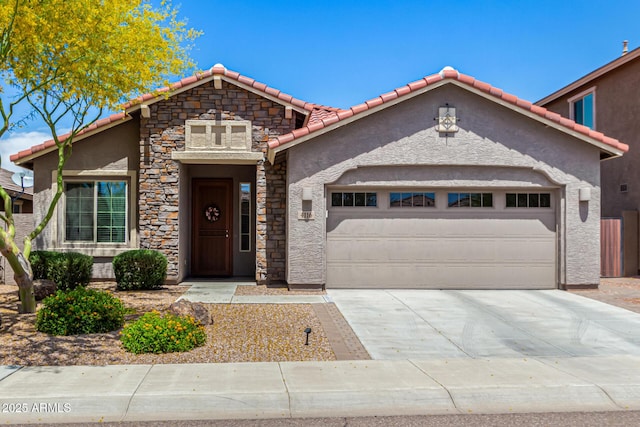 4116 E Roy Rogers Rd, Cave Creek, AZ 85331 - view of front of home featuring a tile roof, a garage, stucco siding, driveway, and stone siding