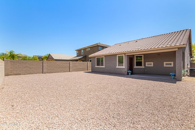 4116 E Roy Rogers Rd, Cave Creek, AZ 85331 - rear view of house with a fenced backyard, stucco siding, a tile roof, a patio, and central AC unit