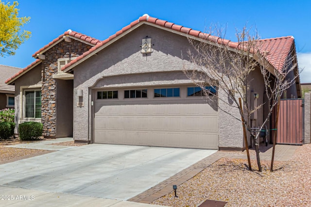 4116 E Roy Rogers Rd, Cave Creek, AZ 85331 - view of front of home featuring an attached garage, a tiled roof, stucco siding, and driveway