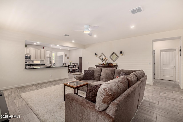 4116 E Roy Rogers Rd, Cave Creek, AZ 85331 - living area featuring ceiling fan, wood tiled floors, baseboards, and recessed lighting