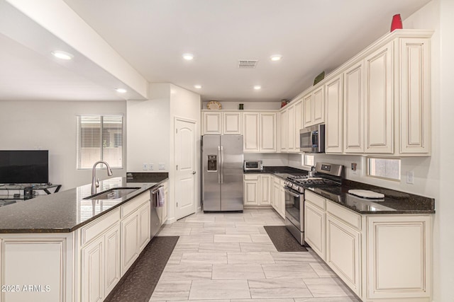 4116 E Roy Rogers Rd, Cave Creek, AZ 85331 - kitchen with appliances with stainless steel finishes, a sink, a peninsula, recessed lighting, and dark stone counters