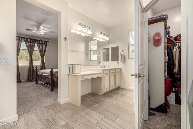 4116 E Roy Rogers Rd, Cave Creek, AZ 85331 - full bathroom featuring ceiling fan, vanity, a spacious closet, and baseboards
