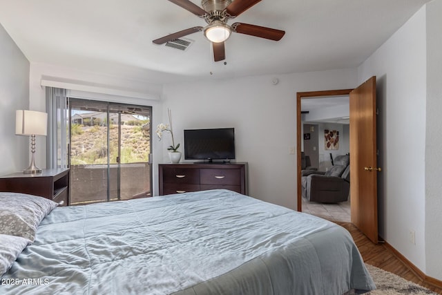 bedroom with access to outside, wood finished floors, a ceiling fan, and baseboards