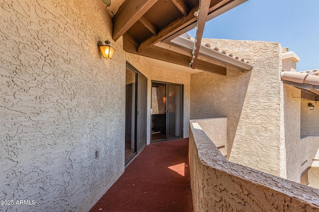 doorway to property with stucco siding