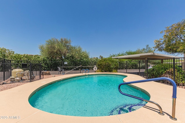 community pool with fence and a patio