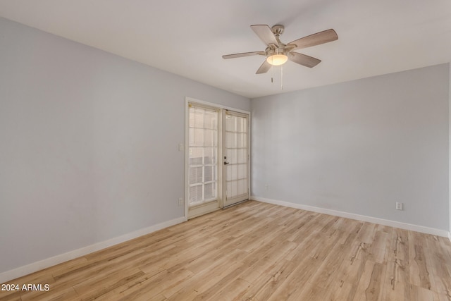 spare room with ceiling fan and light hardwood / wood-style flooring