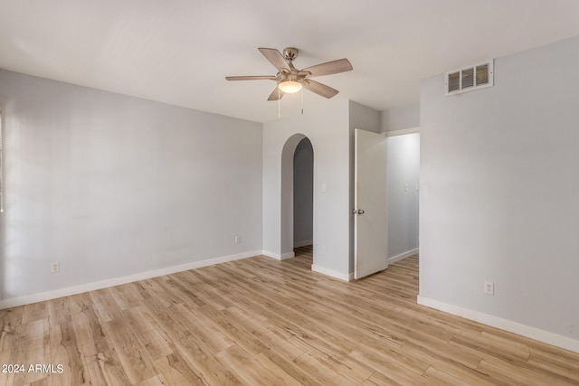 spare room featuring ceiling fan and light wood-type flooring