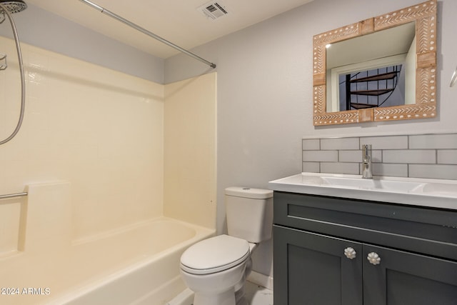 full bathroom featuring tasteful backsplash, bathtub / shower combination, vanity, and toilet