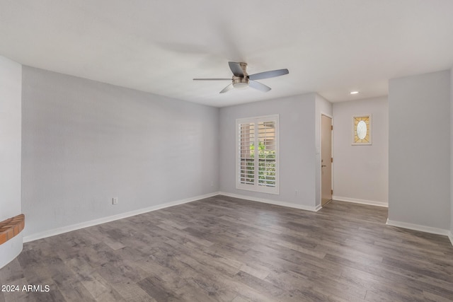 unfurnished room with ceiling fan and wood-type flooring