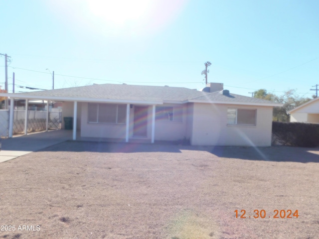 view of front of house featuring a carport