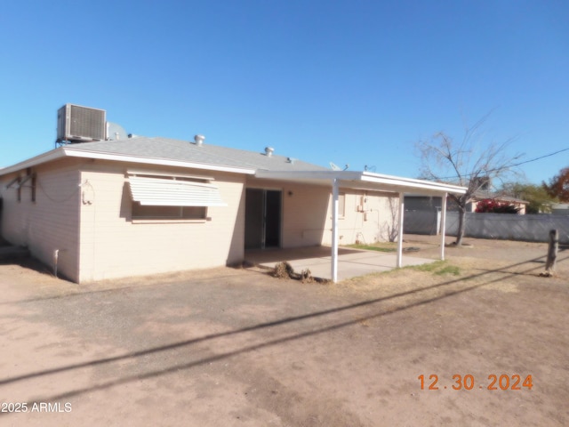 back of property featuring a patio area and central AC