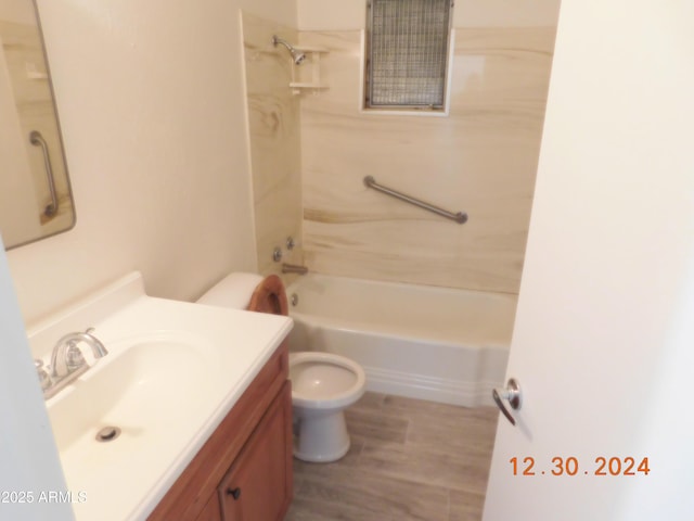 full bathroom with shower / bathing tub combination, vanity, toilet, and hardwood / wood-style floors