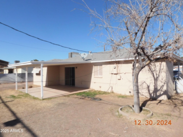 rear view of house with a patio