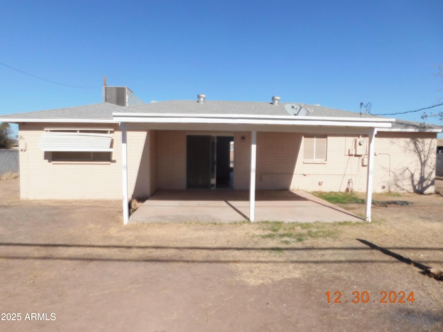 rear view of property featuring a patio area