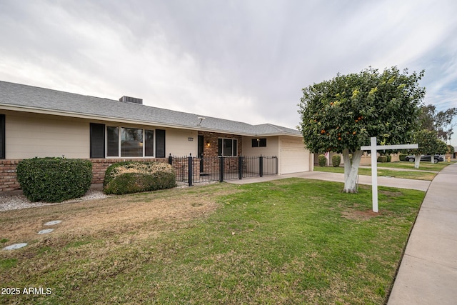 single story home with a front yard and a garage