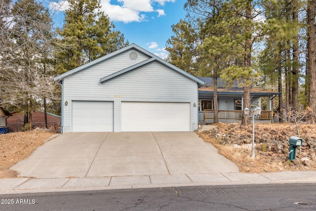 ranch-style home with covered porch and a garage