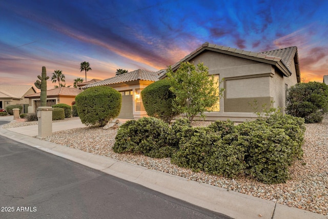 view of front of property with a garage